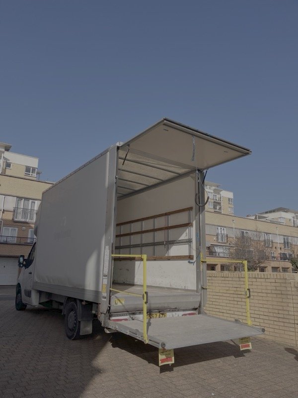 Luton van with tail lift open showing spacious cargo area