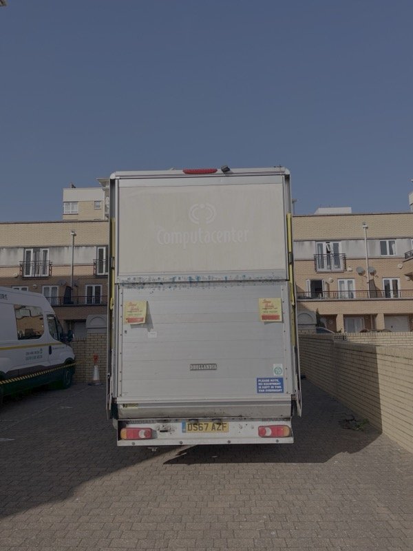 Rear view of Luton van with hydraulic tail lift